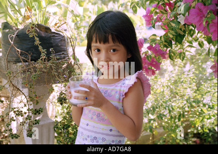 Girl drinks her milk Stock Photo