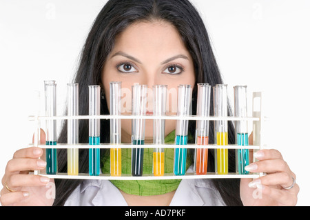 Portrait of a female technician holding a test tube rack Stock Photo