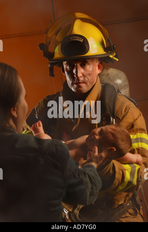 Fire Rescue Baby Fire fighter rescuing child Stock Photo: 28709580 - Alamy