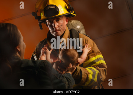 Fireman rescues baby Stock Photo