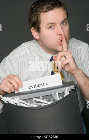 Man shredding evidence Stock Photo