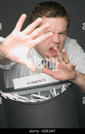 Man shredding evidence Stock Photo