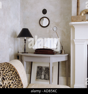 Console table with book stand and magnifying glass Stock Photo