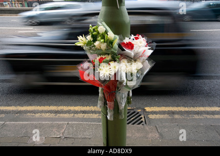 A floral tribute fastened to a lamp post at the scene of a road accident in Birmingham Stock Photo