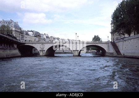 view throught the spans of some of the river Seines many bridges Stock Photo