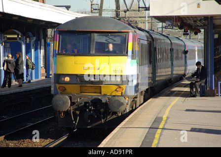 Train serving East Anglia main line destinations passing through Shenfield station near Brentwood Essex Stock Photo