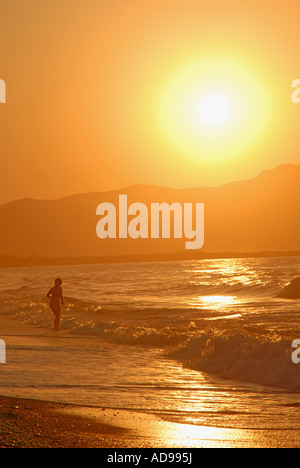 CRETE, GREECE. Sunset over the Rodhopou Peninsula as seen from the beach between Maleme and Gerani near Hania Stock Photo