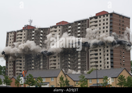 Clouds of dust engulf Ardler village after controlled explosions demolishing the last multi-storey building in Dundee, UK
