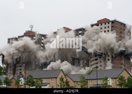 Clouds of dust engulf Ardler village after controlled explosions demolishing the last multi-storey building in Dundee, UK