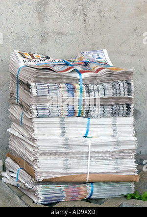 Pile of leaflets lying on the ground and waiting for delivery , Finland Stock Photo