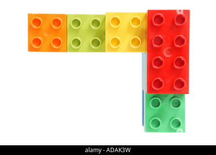 simple corner construction made from childs lego in studio red green yellow orange Stock Photo