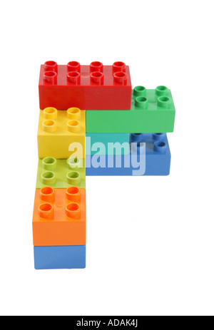 corner construction made from childs lego in studio on clean white surface involving blue orange yellow green and red color Stock Photo