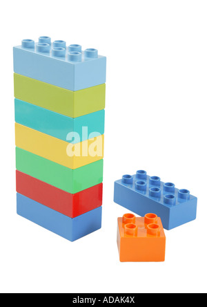 simple upright vertical construction made from childs lego in studio on clean white surface.  blue orange yellow red green Stock Photo