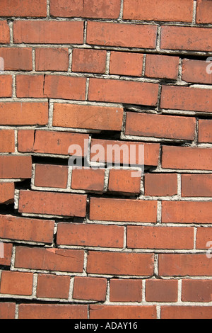 crumbling red brick wall Stock Photo