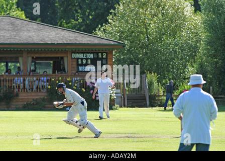 Village cricket at Dumbleton, Gloucestershire, England, UK Stock Photo