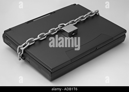 Chain and Padlock Securing a Laptop Computer Stock Photo