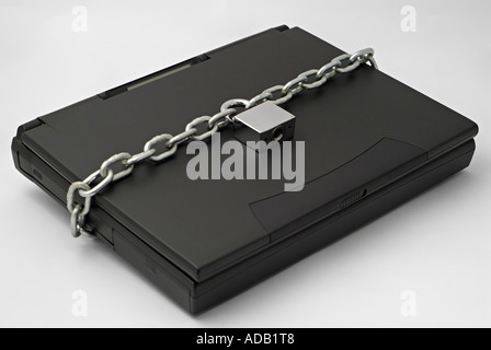 Chain and Padlock Securing a Laptop Computer Stock Photo