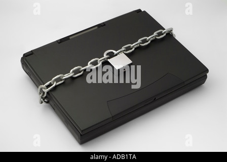 Chain and Padlock Securing a Laptop Computer Stock Photo