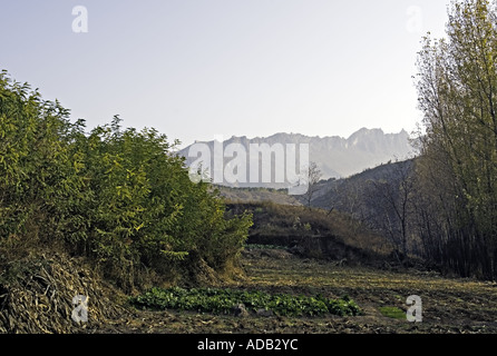 CHINA SIMATAI The Great Wall of China as seen outlined along nearby mountains at sunrise in the rural Simatai region Stock Photo