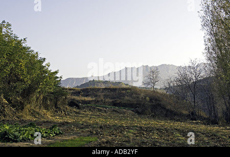 CHINA SIMATAI The Great Wall of China as seen outlined along nearby mountains at sunrise in the rural Simatai region Stock Photo