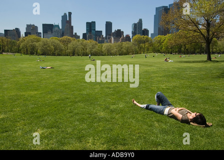 Woman Lying on the Grass in Sheep Meadow in Central Park, April 2006 Stock Photo