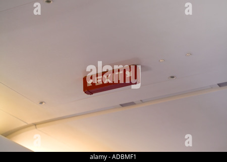 exit sign on airplane interior Stock Photo