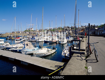 dh  FINDOCHTY MORAY Yachts in harbour bicycle and fishing village cycle parked scotland biking Stock Photo