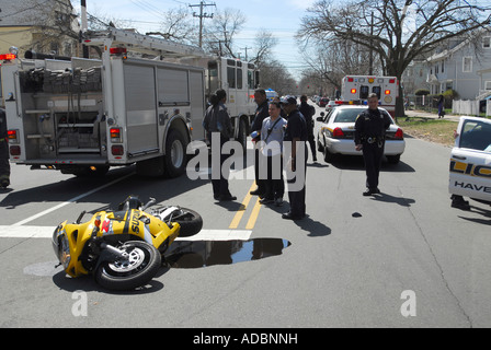 Police and firefighters look over the scene of a motorcycle crash in New Haven Connecticut Stock Photo