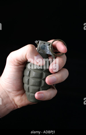 Hand Holding grenade Stock Photo