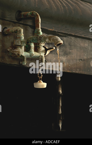 Old Rusty Dripping Water Spigot Stock Photo