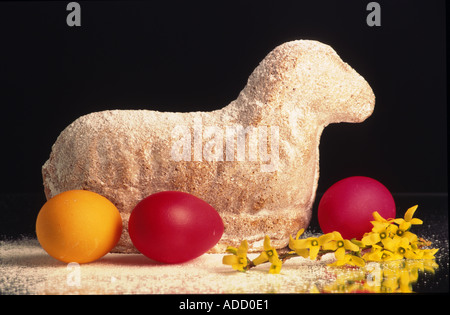 easter lamb cake and colored eggs traditional cake Stock Photo