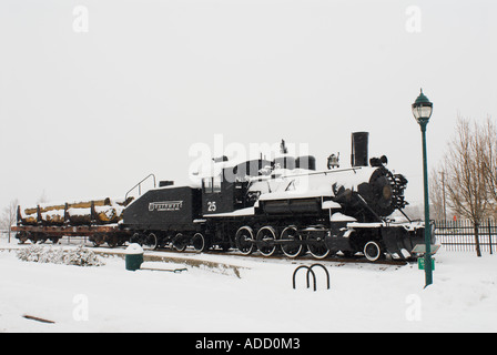 Baldwin steam engine Number 25 in a winter snow storm in downtown Flagstaff Arizona Stock Photo