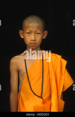 A young novice monk after he has gone through the Poy Sang Long the ordination of novice monks in Mae Hong Son Thailand Stock Photo