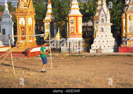 Boy Playing Football In Front Of Stupas Stock Photo