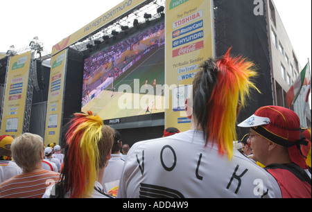 German football fans watching a match at a public viewing event Stock Photo