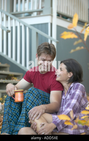 couple in pajamas on steps in the morning at Chautauqua Boulder Colorado Stock Photo