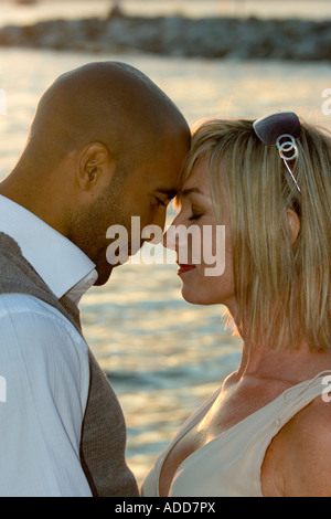 Close Up Head and Shoulders Interracial love story of a black man and a white woman Stock Photo