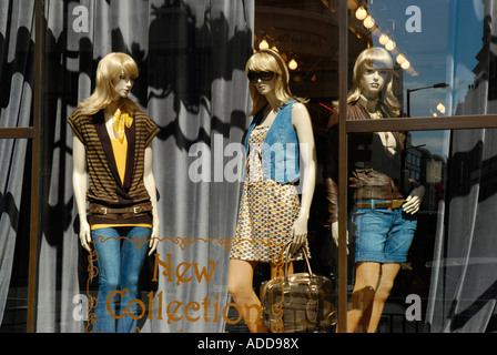 Regent Street fashion shop window showing 3 attractive female mannequins dressed in casual attire Stock Photo