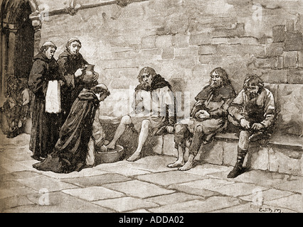 Becket washing the feet of beggars. Saint Thomas Becket, c.1118 - 1170. English martyr and Archbishop of Canterbury. Stock Photo