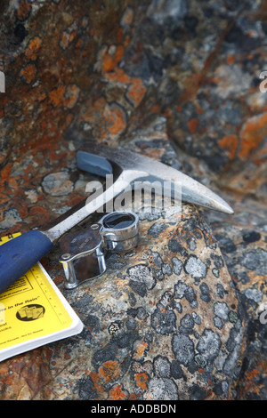 Mining  concept image of geologists rock hammer notebook and magnifier Stock Photo