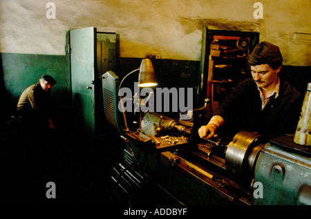 MAN WORKING ON LATHE AT DONETSKE COAL MINE Stock Photo