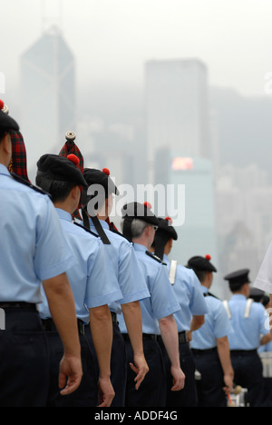 Chinese policeman wearing the traditional Scottish Balmoral hat taking part in the Hong Kong Chinese New Year Parade in China Stock Photo