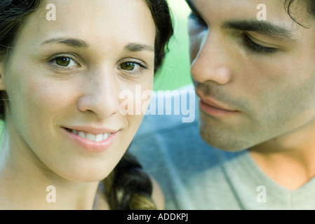 Couple, woman smiling at camera, close-up Stock Photo