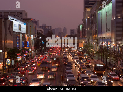 Rush hour traffic at dusk, financial district in background Stock Photo