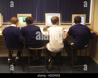 Students in school using computers Stock Photo