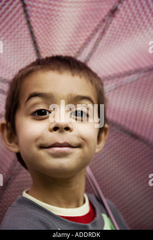 Smiling boy with umbrella Stock Photo
