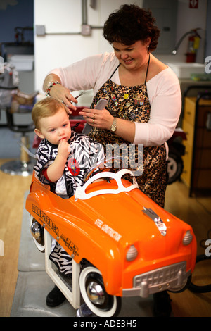 One year old boy getting first haircut Stock Photo