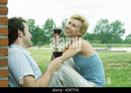 Couple drinking wine outdoors Stock Photo
