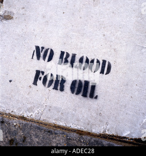 No Blood For Oil sign stencilled on London pavement during the Anti War Rally march demo demonstration in London in February 2003 KATHY DEWITT Stock Photo