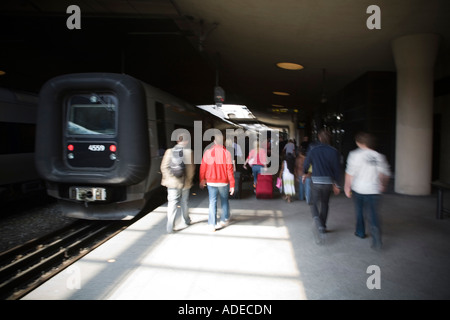 Commuters and train at Kastrup Station in Copenhagen, Denmark. Stock Photo